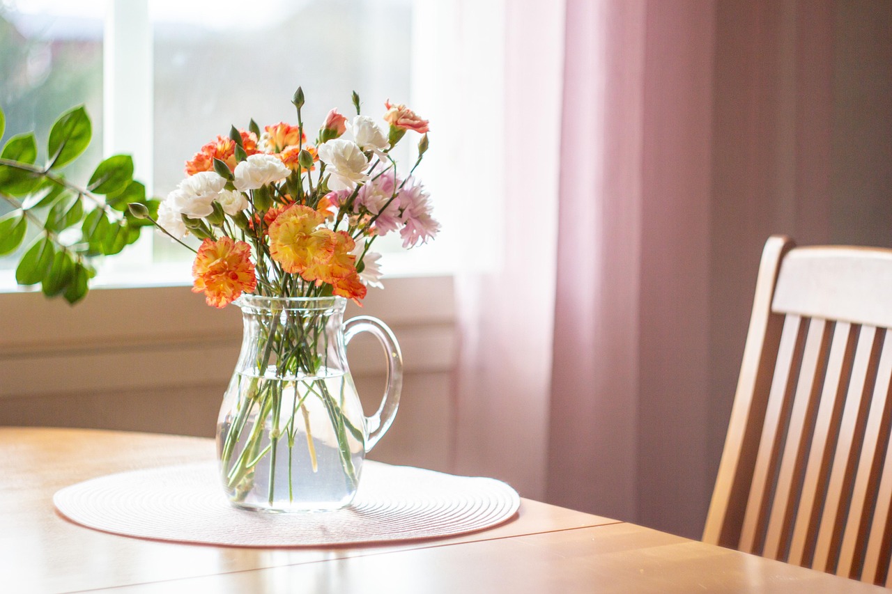 Woman Enjoying flowers in the home