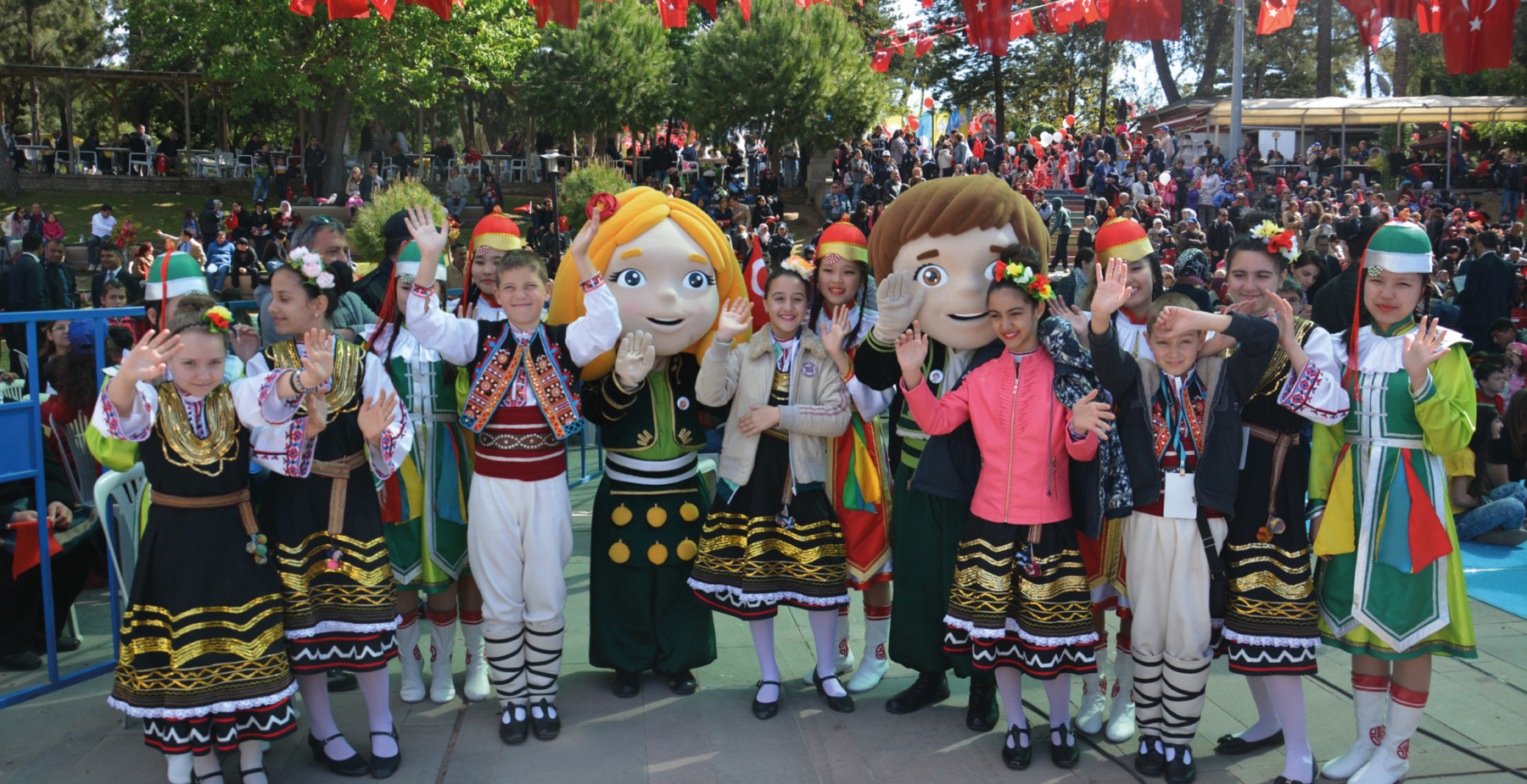 Children waving at festival
