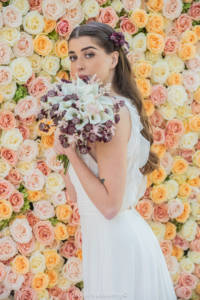 Bride modelling a bouquet of wedding flowers