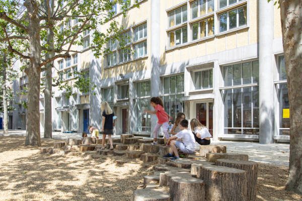 Children playing in a schoolyard in Paris
