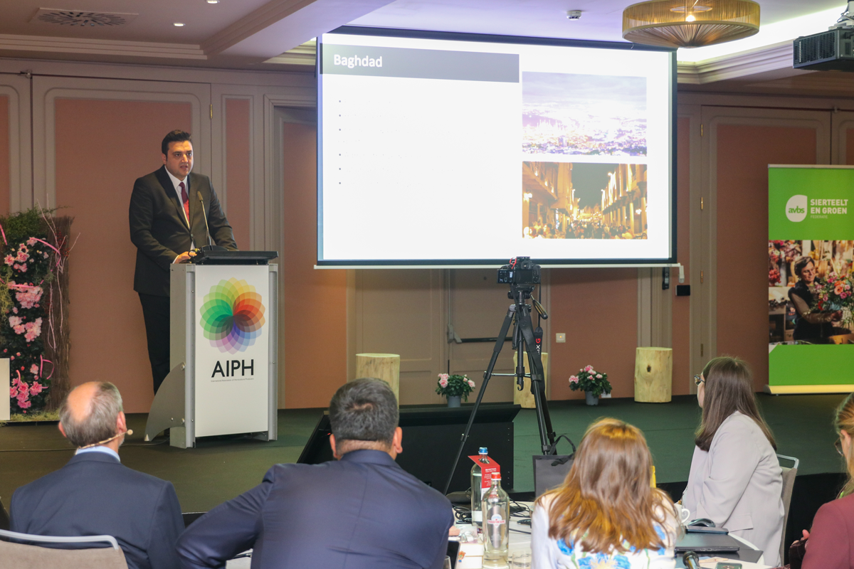 Mr Harun Guzel, representing Expo 2029 Baghdad, presents details of the application to the AIPH Congress audience, with slides about Baghdad projected on screen.