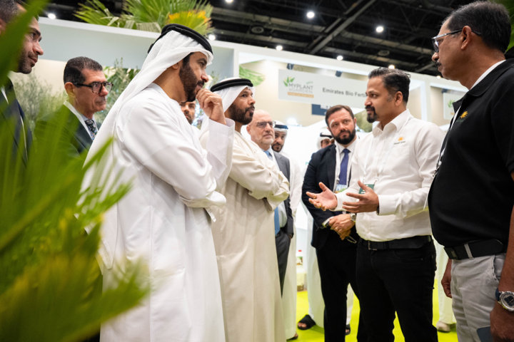 Government representatives and industry professionals in discussion at a stand during Myplant & Garden Middle East.
