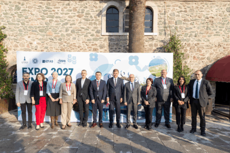 Officials and representatives pose together at the Expo İzmir 2027 stakeholder workshop venue.
