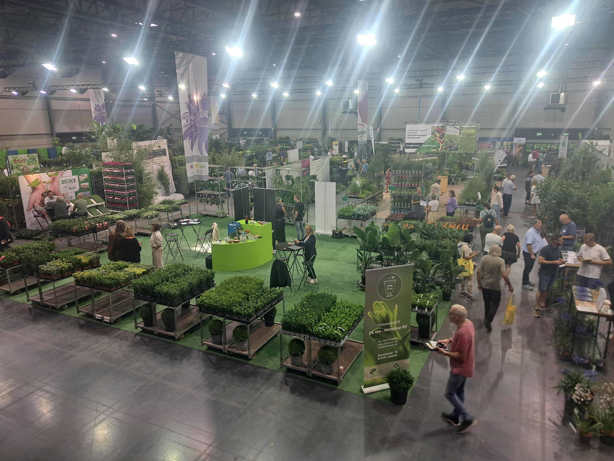Exhibition hall filled with nursery stock and trade visitors at Florall Belgium.
