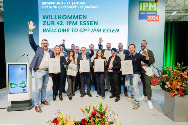 IPM ESSEN 2026 Plant Innovations winners holding certificates on stage.