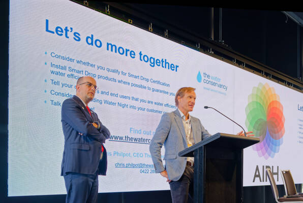 Chris Philpot and Jack Goossens speaking on stage at the AIPH Horticultural Industry Conference in Sydney