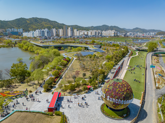 Aerial view of the park at Suncheon Expo 2023 in the Republic of Korea with gardens and visitors.