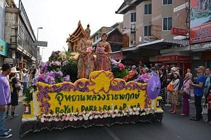 Floral parade float covered in orchids and chrysanthemums during the Chiang Mai Flower Festival.