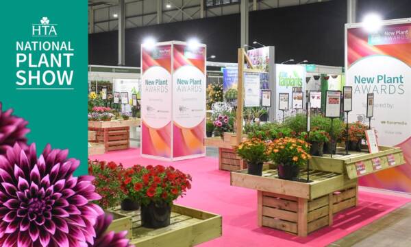 New Plant Awards display area at the HTA National Plant Show, featuring potted ornamental plants and exhibitor stands at NAEC Stoneleigh.
