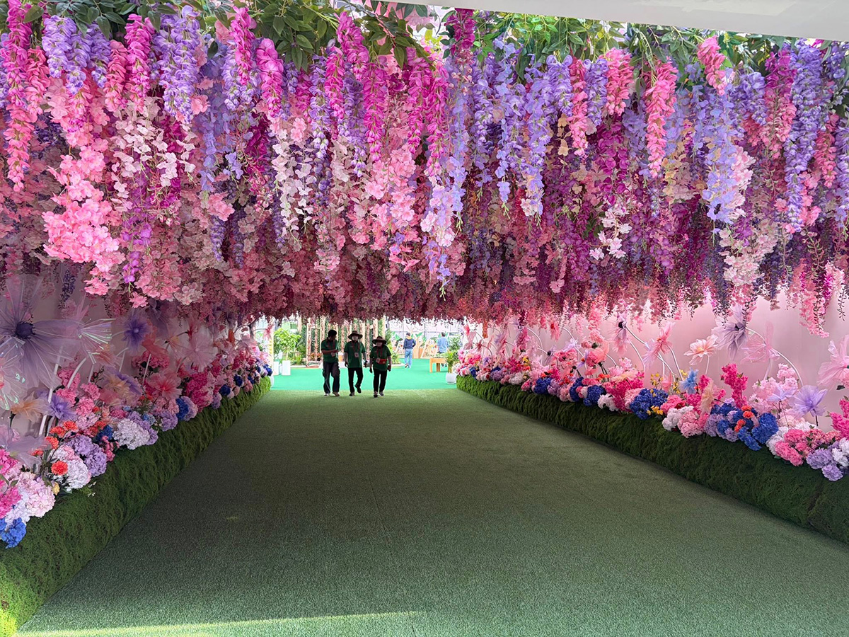 Visitors walking through a floral tunnel installation at Taean Expo 2026