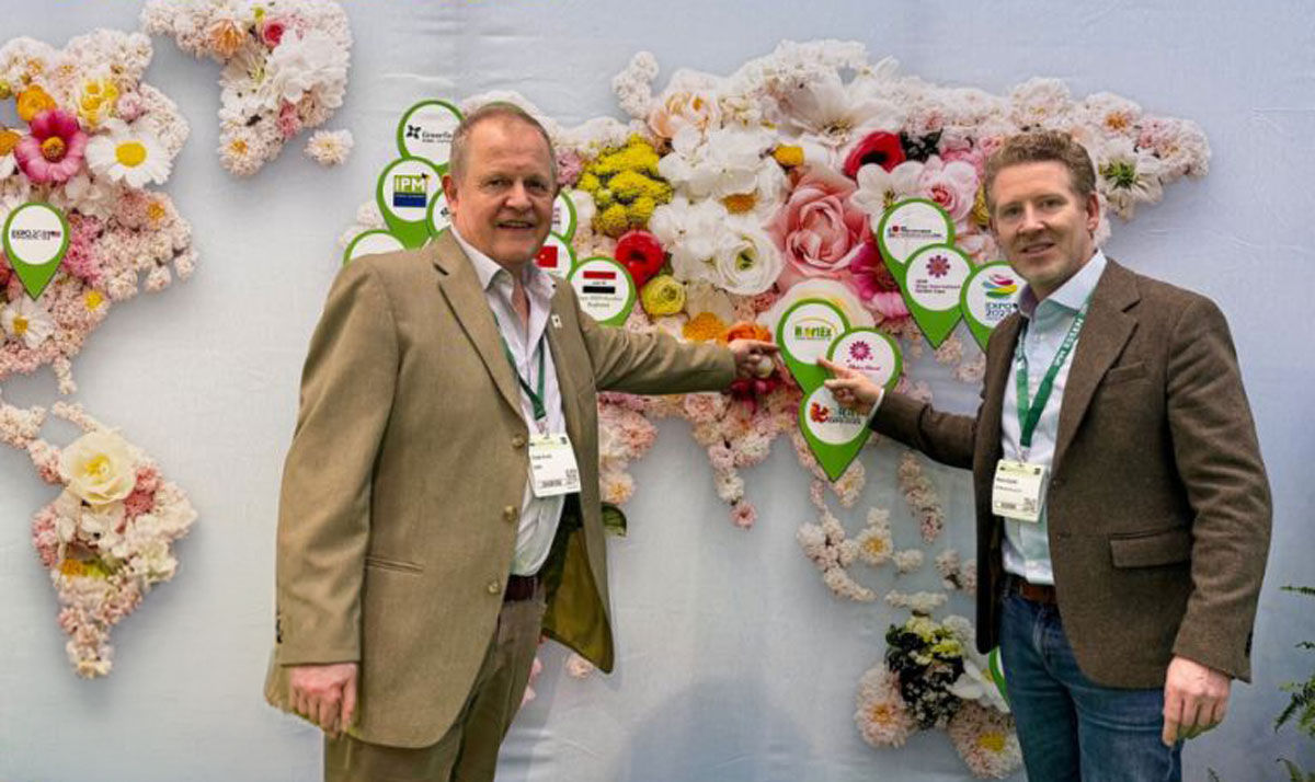 Treve Evans and Kuno Jacobs at IPM Essen highlighting Thailand on floral world map display