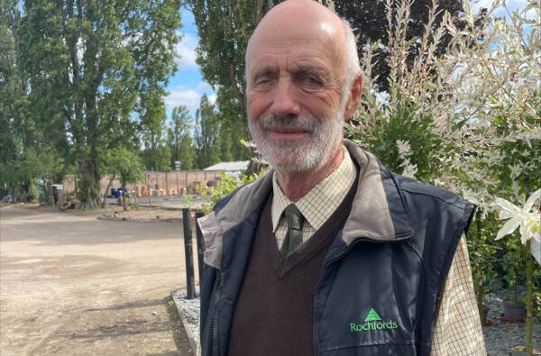 Paul Rochford standing at Joseph Rochford Gardens, wearing a Rochfords waistcoat.