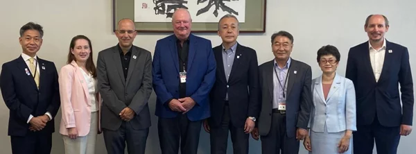 AIPH delegation and the Deputy Mayor of Yokohama City, formally facing the camera for a photograph.
