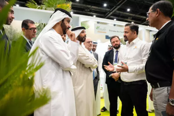 Government representatives and industry professionals in discussion at a stand during Myplant & Garden Middle East.